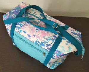 La sac de voyage avec sa sangle